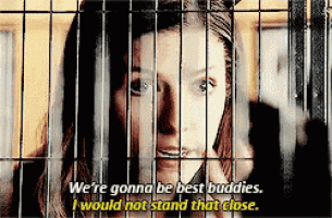 a woman in a cage with the words we 're gonna be best buddies i would not stand that close