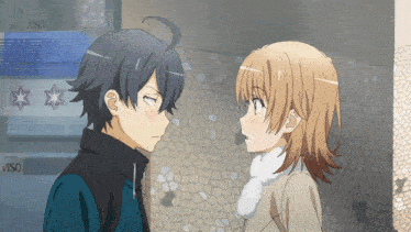 a boy and a girl are looking at each other in front of a sign that says " iso "