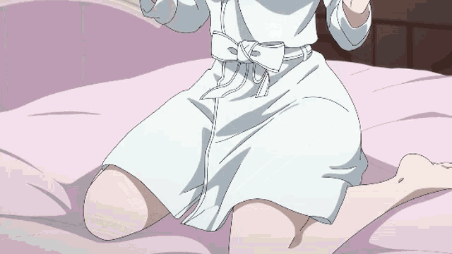 a girl in a white dress sits on a bed with her legs crossed