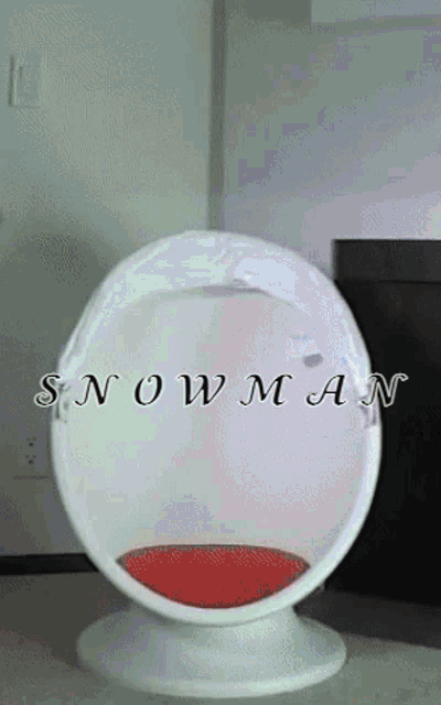 a white chair with a red cushion and the words snowman on it