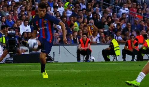 a soccer player wearing a jersey that says botify on it kicks the ball
