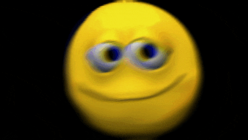 a blurry image of a yellow smiley face with blue eyes