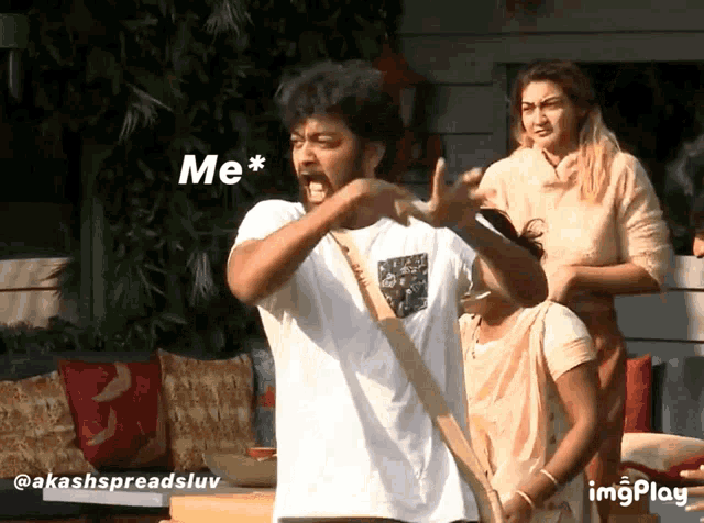 a man in a white shirt is making a funny face with the words me * behind him