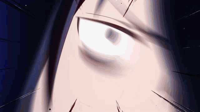 a close up of a person 's eye with a dark background .