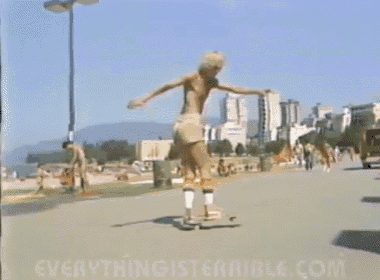 a man riding a skateboard on a sidewalk with the website everythingisterrible.com