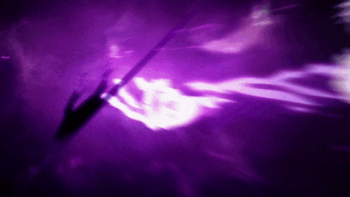 a purple background with a white glowing object