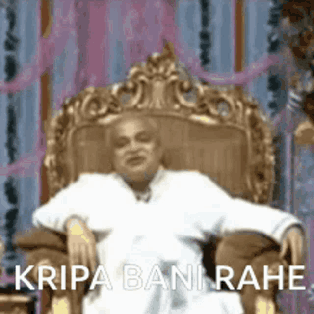 a man is sitting in a chair with his arms outstretched and the words kripa bani rahe written on the bottom .