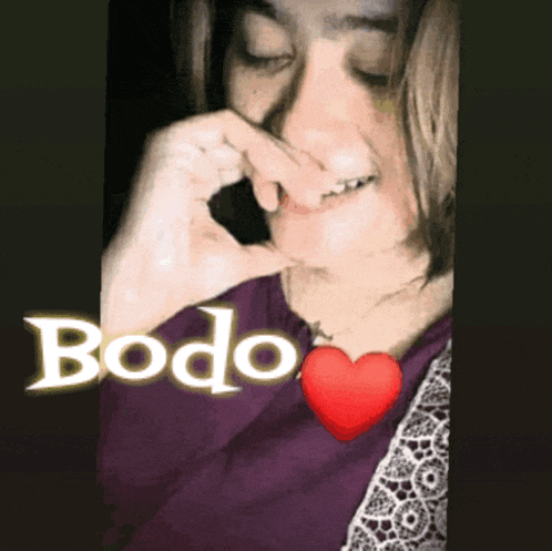 a woman covering her nose with her hand with the word bodo written above her