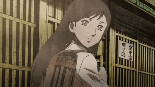 a girl with a backpack stands in front of a building with a sign that says ' karate ' on it