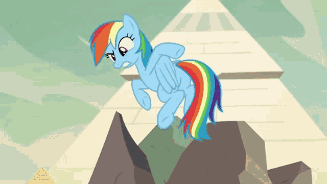 a cartoon pony with a rainbow tail is standing on a rock near a pyramid