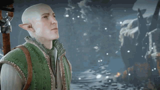 a bald man in a green vest with stitching on it looks up