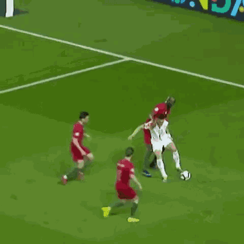a soccer player with the number 10 on his jersey is kicking a ball