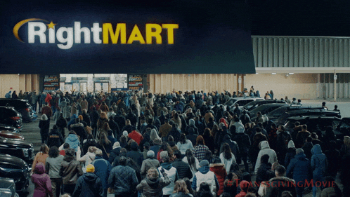 a crowd of people are gathered outside a rightmart store