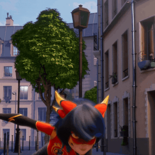 a cartoon character in a red and black costume is standing on a city street
