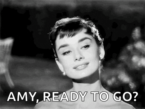 a black and white photo of audrey hepburn with the words amy ready to go