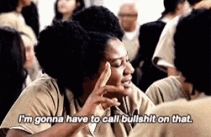 a woman is sitting in a crowd of people and saying `` i 'm gonna have to call bullshit on that ''