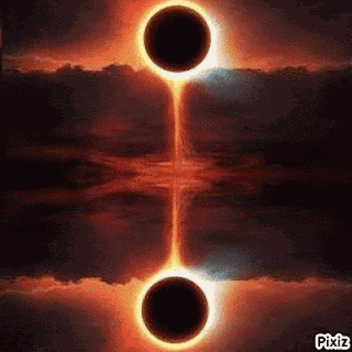 a partial eclipse of the sun with two black holes in the middle of it .