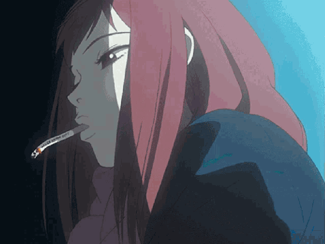 a girl with red hair is smoking a cigarette in a dark room