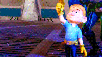 a cartoon character in a blue shirt and yellow gloves holds up his hand