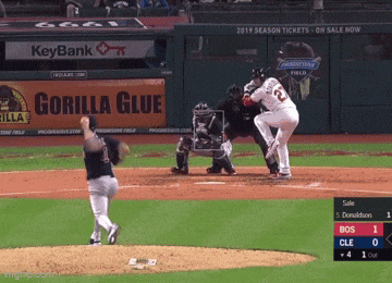 a baseball game is being played with a gorilla glue ad in the outfield