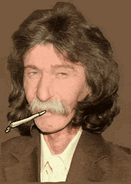 a man with a mustache is smoking a cigarette with a pen in his mouth