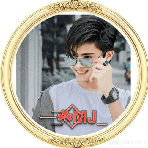 a picture of a young man in a gold frame with the name xmj on it