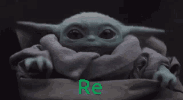 a baby yoda with the word re written in green