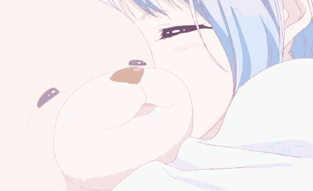 a girl with blue hair is holding a stuffed animal with a yellow nose and mouth