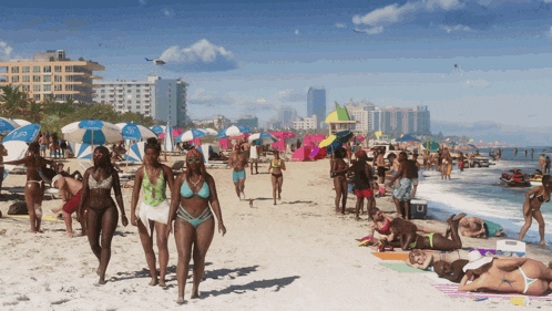 a group of people walking on a beach with an umbrella that says umbrella
