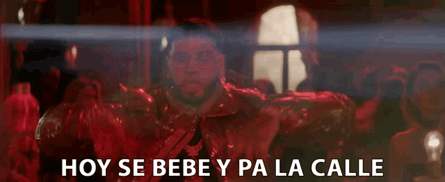 a man in a red jacket with the words hoy se bebe y pa la calle