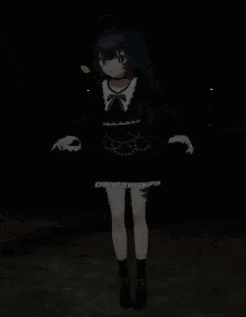 a girl in a black dress is standing in the dark .