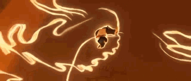 a person is casting a spell on a wall with a drawing of a dragon on it .