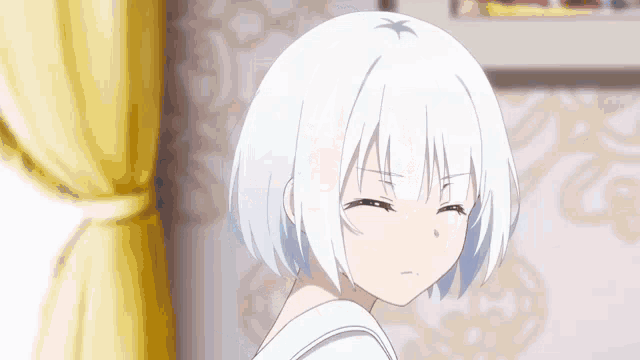 a girl with white hair is making a funny face in a room with a yellow curtain .