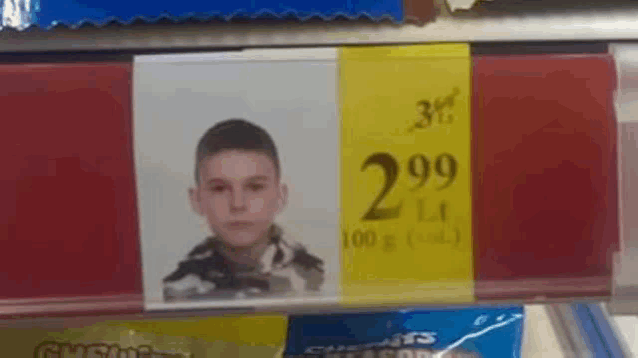 a picture of a boy is on a shelf for 2.99 lt