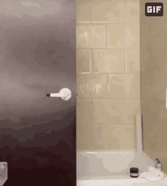 a bathroom with a bathtub and a gif icon