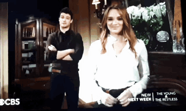 a man and a woman are on a cbs screen
