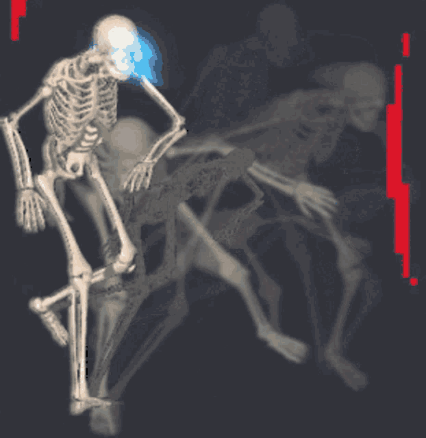 a blurry picture of a skeleton with a blue light coming out of its mouth