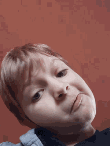 a close up of a person 's face against a red background