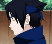 a close up of a person 's face with their eyes closed and a blue headband on their head .