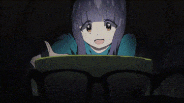 a girl with glasses and purple hair is looking at something
