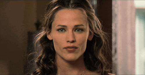 a close up of a woman 's face with her eyes closed