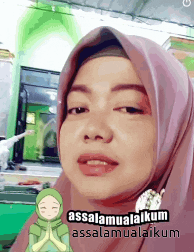a woman wearing a hijab says " assalamualaikum assalamualaikum "