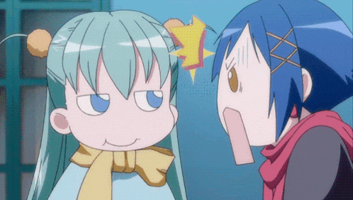 a girl with blue hair is making a funny face next to another girl with green hair