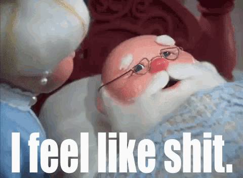 a cartoon of santa claus laying on a bed with the words " i feel like shit " below him