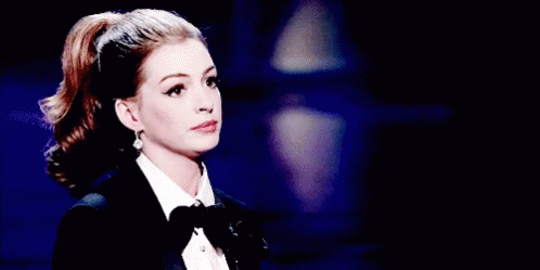 Anne Hathaway Oh Well GIF - Anne Hathaway Oh Well Shrug GIFs