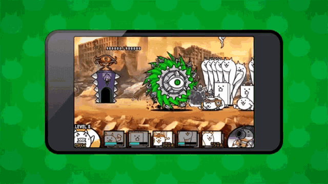 a phone screen shows a game with a green monster in the middle of it