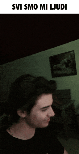 a man 's face is shown with the words svi smo mi ljudi above him