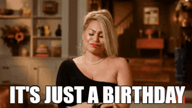 a woman says it 's just a birthday while looking at her phone