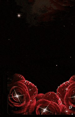 a woman is surrounded by red roses with water drops on them