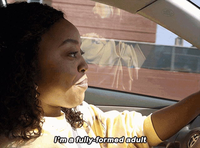 a woman is driving a car and says i 'm a fully formed adult